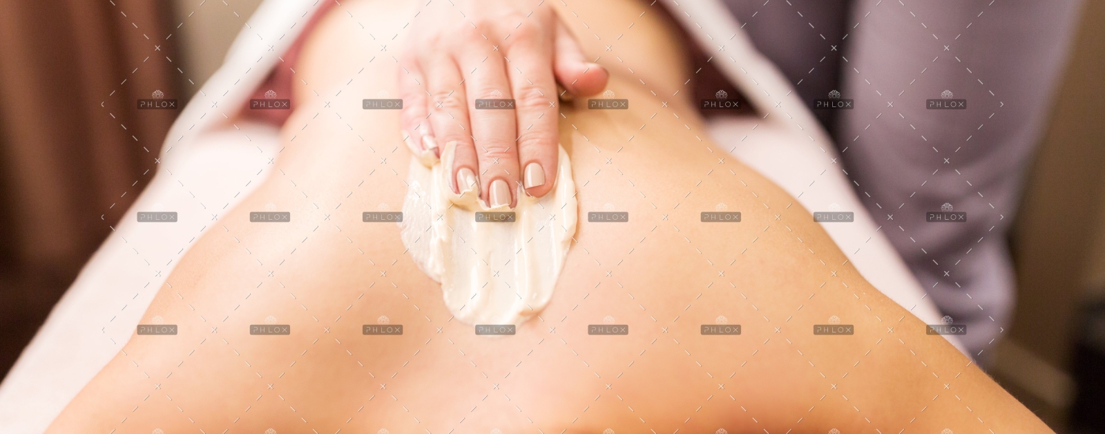 demo-attachment-386-woman-having-back-massage-with-cream-at-spa-PFCWZ34